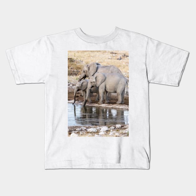 Elephants at the waterhole. Kids T-Shirt by sma1050